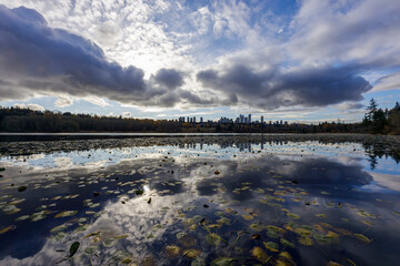 Deer Lake near sunset with clouds reflecting on the water in Burnaby, a suburb of Greater Vancouver