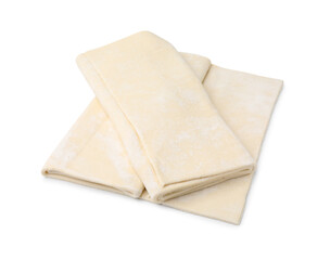 Raw puff pastry dough isolated on white