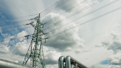 pipeline and power lines against the blue sky