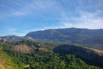 Green mountain landscape with rolling hills and dense forests