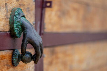 Island Artistry: Handcrafted Door Knocker Graces Grand Garage Door, Infusing Unique Elegance in Caribbean Living