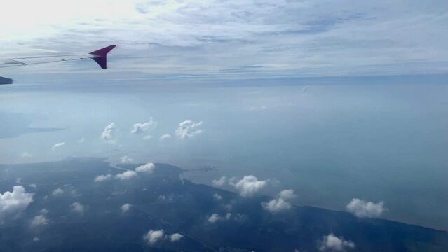 Beautiful aerial view seen through window of flying airplane