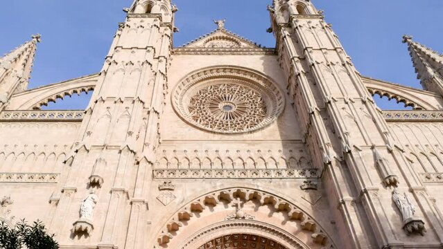 a tilt up clip of the front of the cathedral of santa maria of palma at mallorca in spain