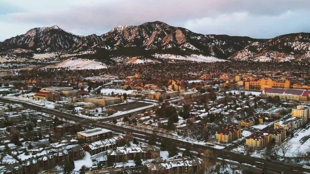 Sunrise against the Flatirons and the University of Colorado Boulder