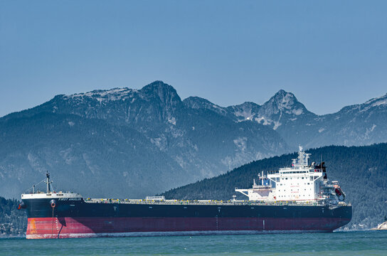 Vancouver, British Columbia, Canada &ndash; August 12, 2021: First Angelus, bulk carrier built in 2020, with carrying capacity of 81984 t DWT, overall length 229 meters, width 32.3 meters, at anchor