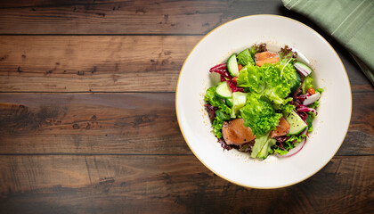 Fresh healthy salad on wooden table. View from above with copy space. high quality photo