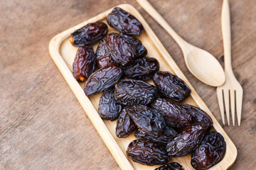 Brown dried Medjool dates are energy-dense fruits rich in many beneficial nutrients.