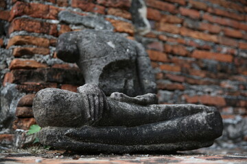 collapsing buddha statue in the temple