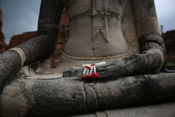 buddha statue with flower