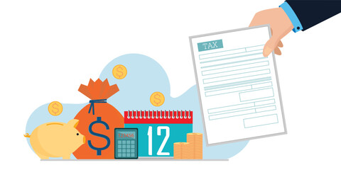 Hand holding tax form isolated on white background.