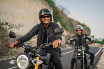 Fototapeta na wymiar fun journey of indonesian bikers riding motorbike traveling outdoors