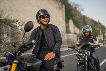 fun adventure of indonensian riders driving motorbike around countryside - obrazy, fototapety, plakaty