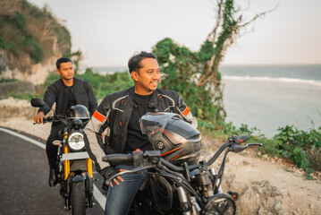 Fototapeta na wymiar asian men riders wearing jacket sitting on motorcycle