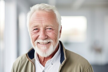 Fototapeta na wymiar Portrait of a senior man with white beard smiling at the camera