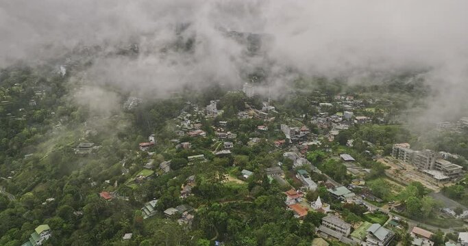 Ella Sri Lanka Aerial v21 drone flyover town center, fly through fluffy clouds capturing hillside resort hotels on the hilly terrains and lush mountain landscape - Shot with Mavic 3 Cine - April 2023