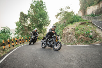 Fototapeta na wymiar asian bikers going on adventure by riding motorbike