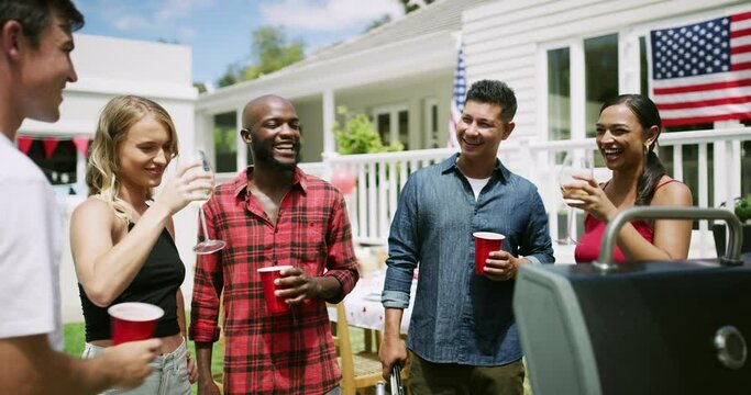 Friends, drinks and toast at party, American flag and celebration for Independence Day with bbq outdoor. Diversity, fun and alcohol on fourth of July, national holiday and people with cheers in USA