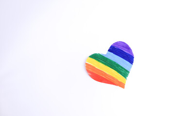 Photograph on light background of hand drawn LGBTQ+ heart. Concept of people and lifestyles.