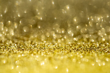 Gold glitter lights background. Gold Glitter backgrounds. Light Gold bokeh to design. Glitter Golds backgrounds for valentines day, birthday Christmas cards. Light abstract background. Golden light.