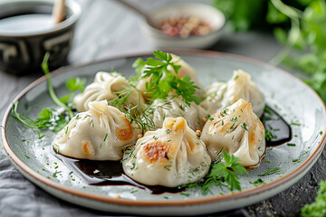 Dumplings served on a white plate.