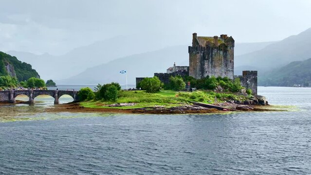 Aerial drone Scotland. Eilean Donan castle in Isle of Skye. Historic medieval castle. Scottish travel destination, tourism landmark in UK. 