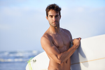 Beach, surfing and portrait of man with surfboard for, waves on summer vacation, weekend and holiday by sea. Travel, nature and face of person by ocean for water sports, adventure or fun in Australia