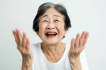歓声をあげて応援する笑顔の日本人女性のおばあちゃん（白背景・オリンピック・日本代表・ワールドカップ・世界大会・Jリーグ・野球・スポーツ） - obrazy, fototapety, plakaty