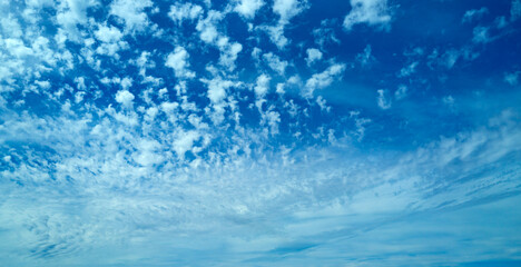 Blue Heaven and white clouds. Sky clouds background. White cloudy on Heaven with soft sun light. Clouds on pastel blue sky background. Sky Landscape Background. Sky Clouds Wallpaper.