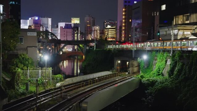 Trains passing in the night in Tokyo, Ocha no Mizu Station background View