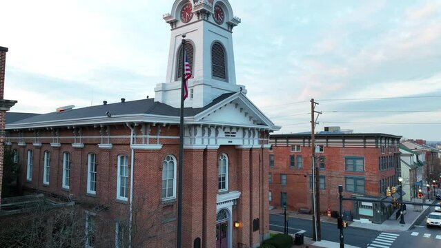 Courthouse in the United States. Aerial establishing shot of brick exterior and American flag.