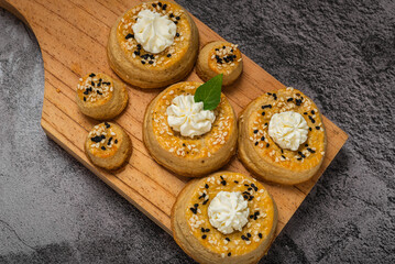 Fototapeta na wymiar Puff pastry rolls with cream cheese. Desserts with cream cheese.