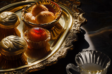 Opulent Dessert Assortment on a Vintage Golden Platter