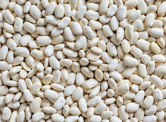 Heap of white haricot beans background.