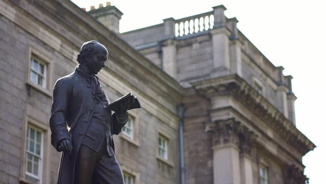 Oliver Goldsmith's statue outside Trinity College Dublin, Ireland.
