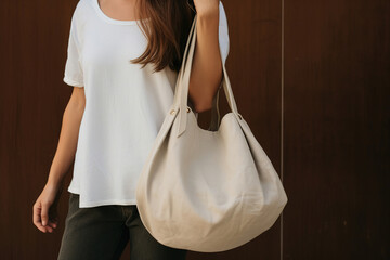 cropped image of a woman with a fashionable handbag. Copy space.