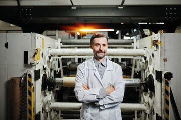 Fototapeta na wymiar Portrait of industrial worker at the factory