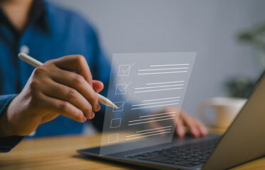 Business performance checklist concept, filling out digital form checklist. Businessman using...