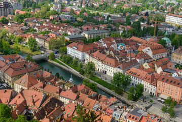 Fototapeta na wymiar aerial view of the city Ljubljana, Slovenia. Red roofs of houses in a European city
