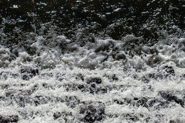 A full frame photograph looking down at a waterfall