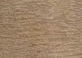 Raw and uneven finishes of cement texture in horizontal linen pattern of wall finishes.