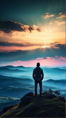 portrait of a man standing at the end of a hill, brave, looking at the view with beautiful sunlight - obrazy, fototapety, plakaty