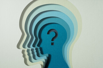 Question about mental and mind. Psychology and brain science. Question mark and stacked person head silhouettes.