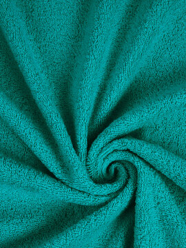 texture of a colored towel. bright diamond color. greenery