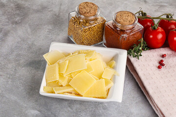Sliced parmesan cheese in the bowl