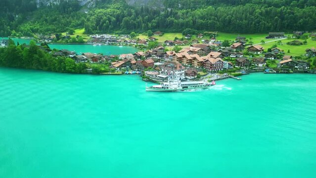 Drone Switzerland 4k. Old steamboat ship tourist boat on lake Thun Brienz in Interlaken. Beautiful Swiss Alps mountains, alpine lake. Switzerland tourism in summer. 