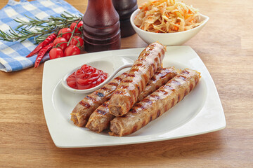 Grilled sausages with cabbage and sauce