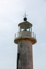 Old concrete lighthouse and empty sky