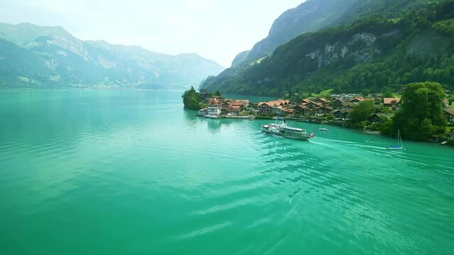 Drone Switzerland 4k. Old steamboat ship tourist boat on lake Thun Brienz in Interlaken. Beautiful Swiss Alps mountains, alpine lake. Switzerland tourism in summer. 