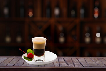 Empty wooden bar counter with blurred background of drink bottles. bar restaurant..