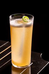 Luxury cocktail on the wooden table on a dark background